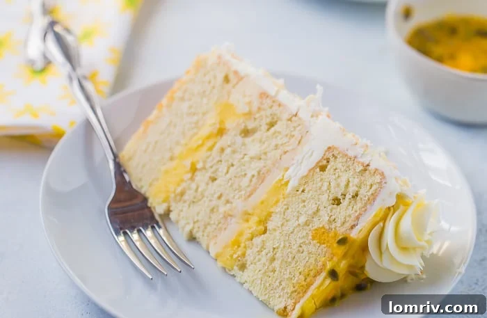 Close-up of a slice of Passionfruit Coconut Layer Cake, showing the curd.