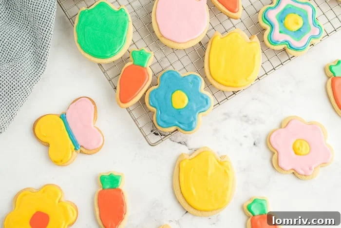 Decorated spring flower and carrot cookies with pastel royal icing, ready to be enjoyed