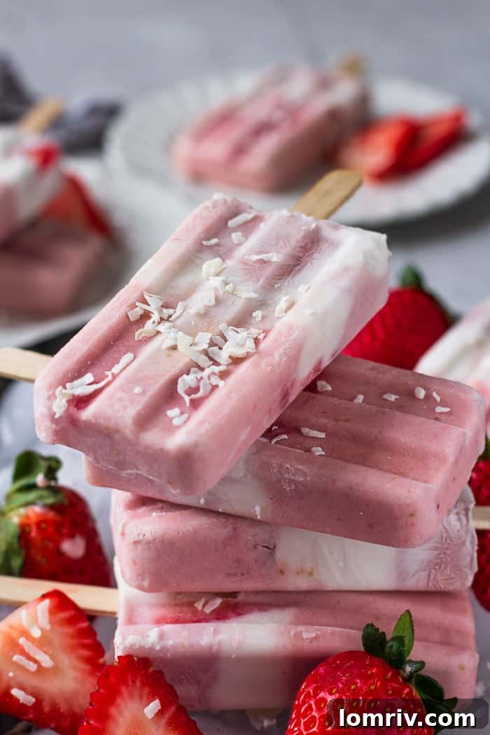 Layers of Strawberry and Cream Popsicles