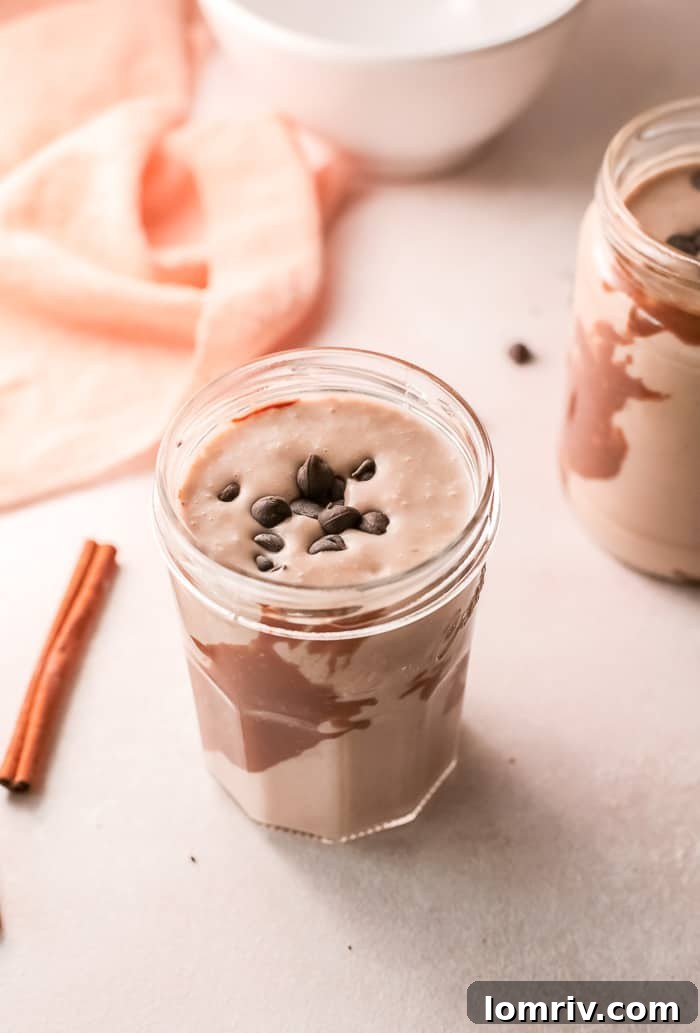 Delicious Banana Bread Smoothie in a glass with cinnamon sprinkle
