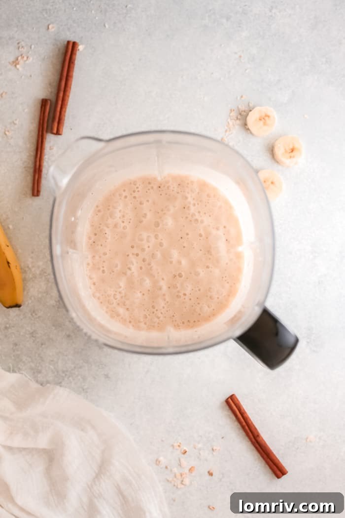 Overhead shot of a Banana Bread Smoothie with toppings
