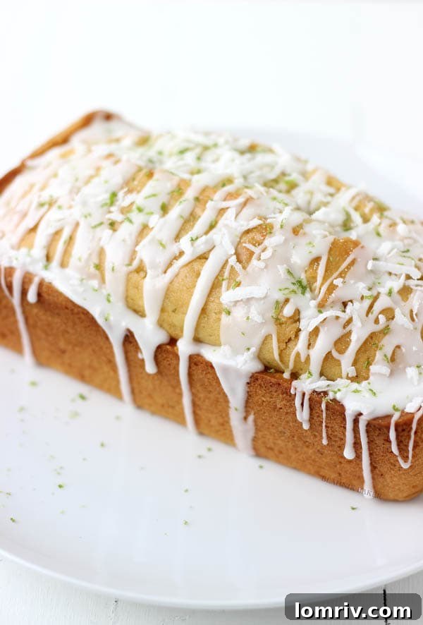 Coconut Key Lime Bread sliced on a cooling rack
