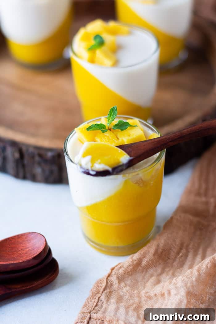 Mango Panna Cotta served with fresh mango cubes and mint