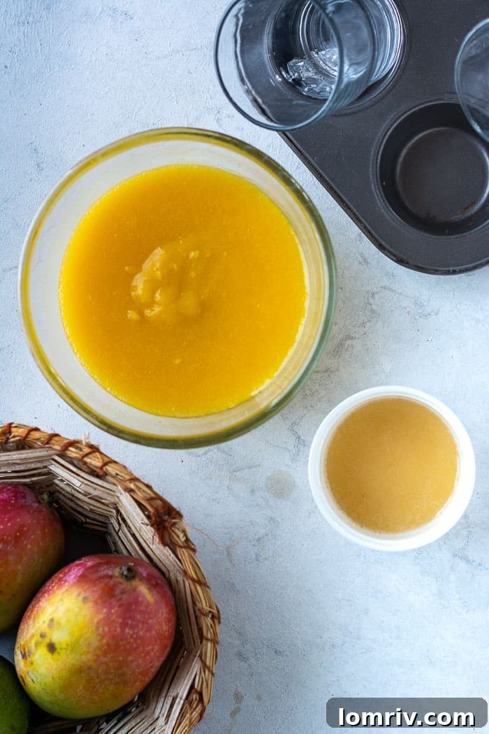 Pouring the mango panna cotta layer into angled glasses