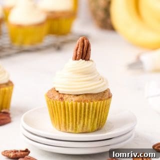 Hummingbird Cupcakes with cream cheese frosting and pecans.