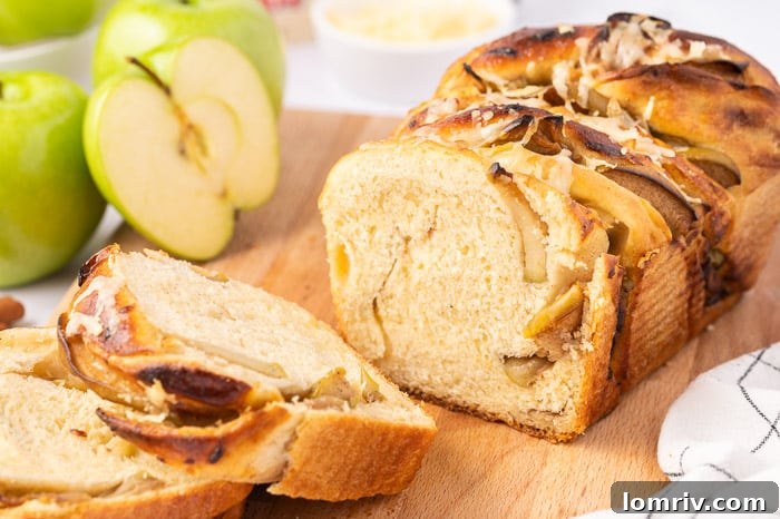 Freshly sliced Apple Cheddar Twist Bread served warm, ready to be enjoyed