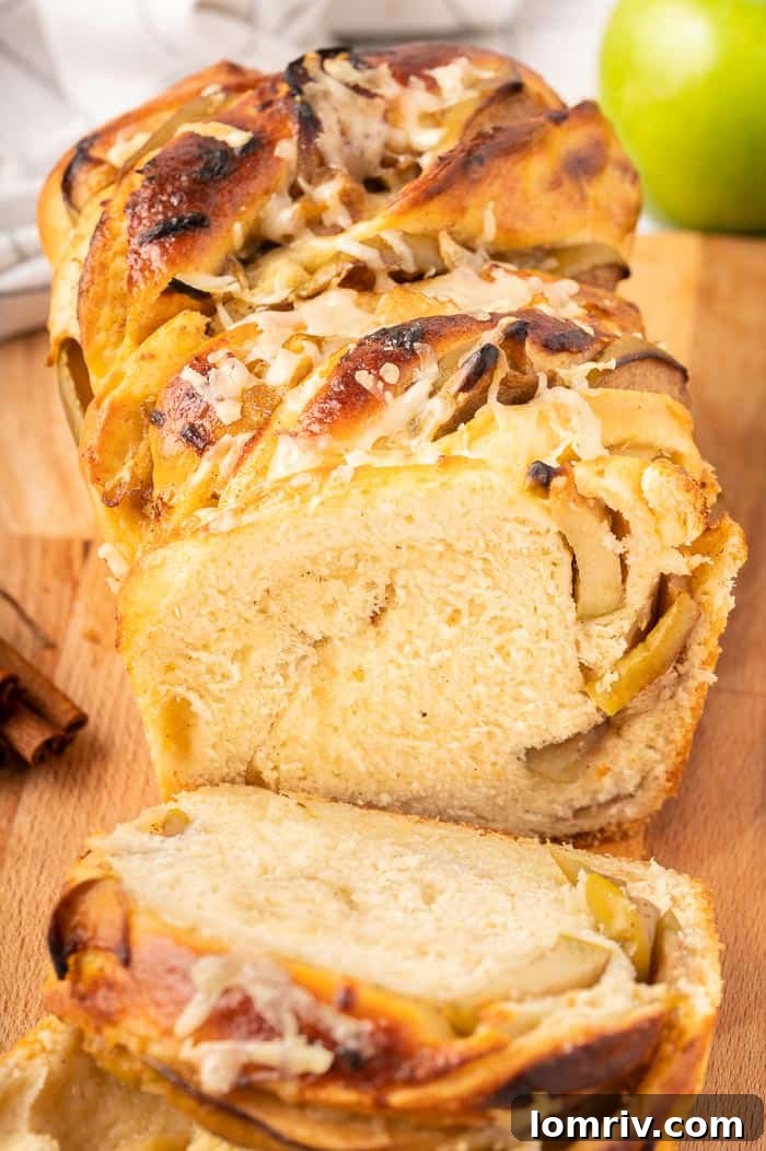Close-up of freshly baked Apple Cheddar Twist Bread with visible apple and cheddar layers