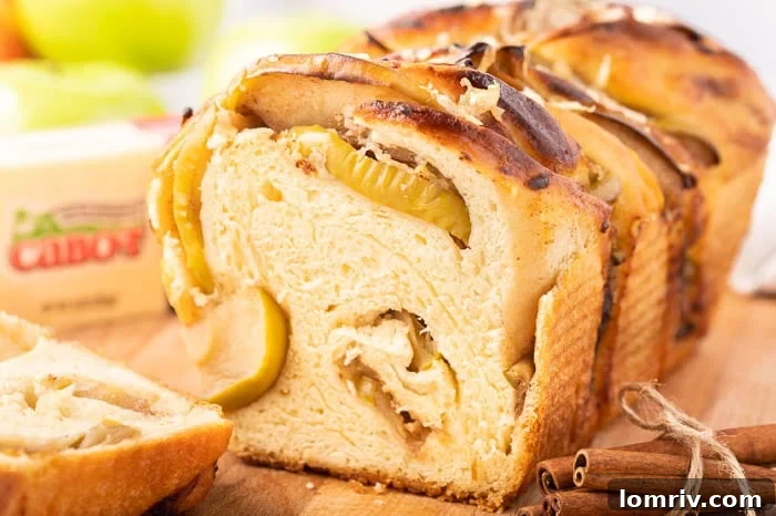 The delicious filling of caramelized apples and Cabot cheddar cheese spread on dough
