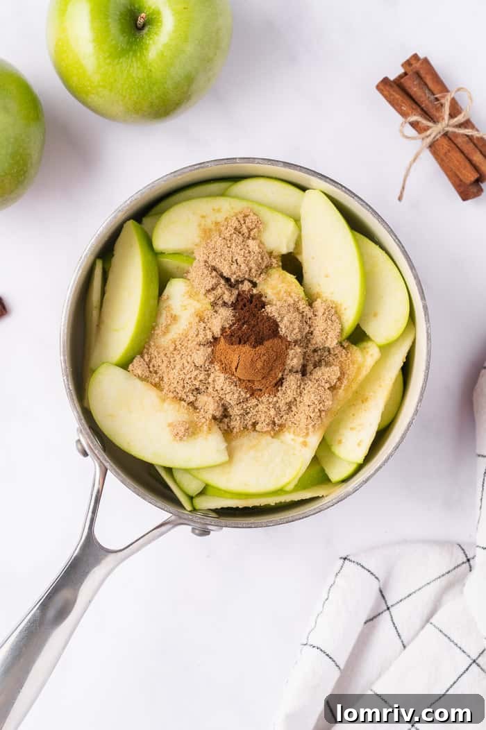 Spiced and caramelized apple pie filling cooling in a pan