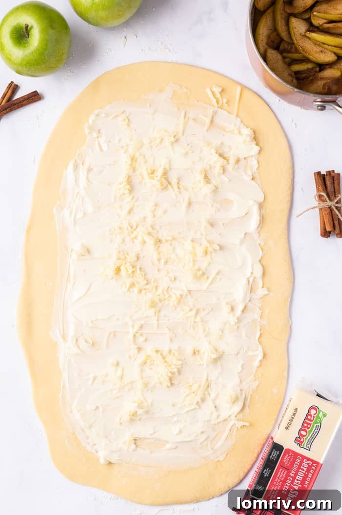 Melted butter spread across the rectangular dough, ready for filling