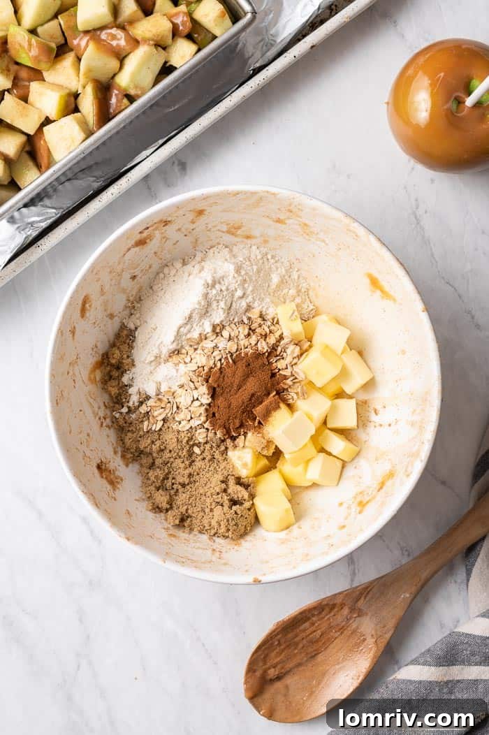 Applying Streusel Topping to Caramel Apple Crisp