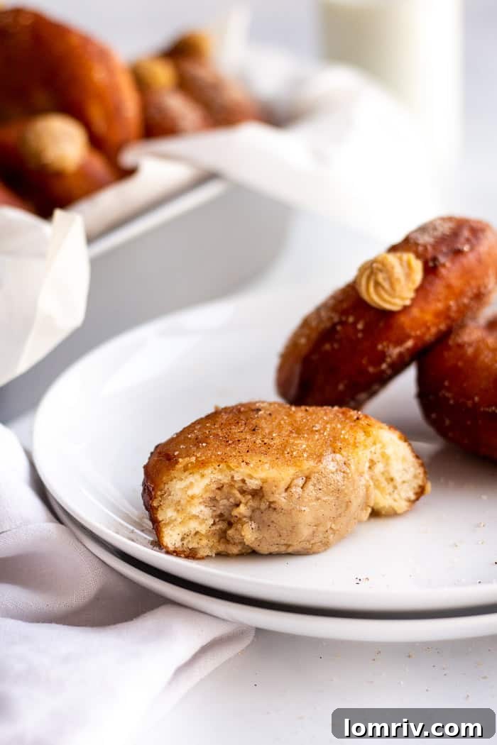 A plate of freshly baked Pumpkin Spice Bomboloni