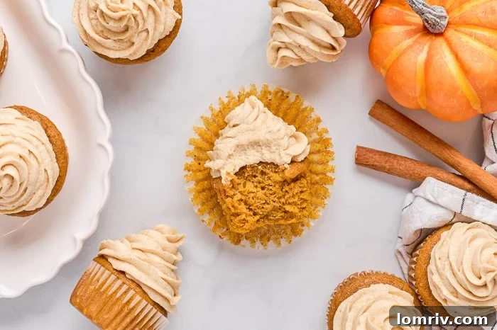 Close-up of a beautifully decorated pumpkin cupcake with brown sugar frosting