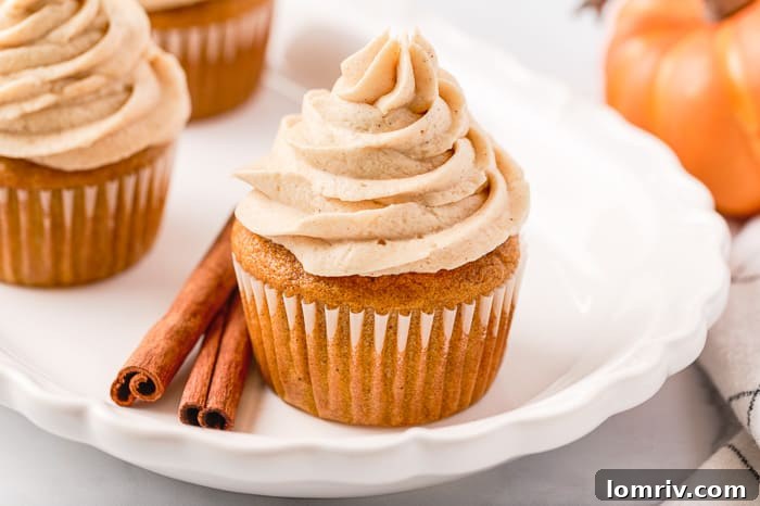 Overhead shot of pumpkin cupcake batter being prepared in a mixing bowl