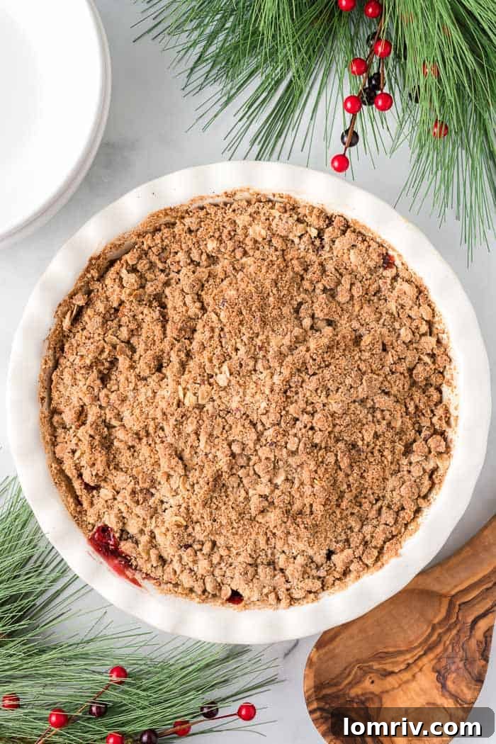 Cranberry Apple Crisp served with a scoop of vanilla ice cream