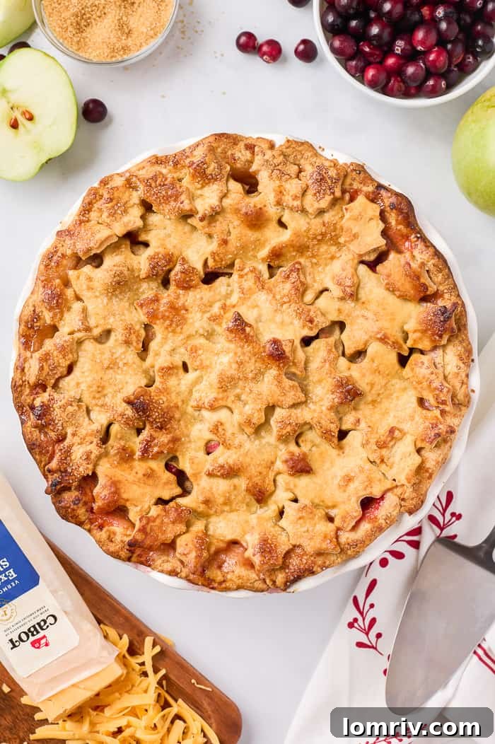 Delicious Apple Cheddar Cranberry Pie on a cooling rack, freshly baked