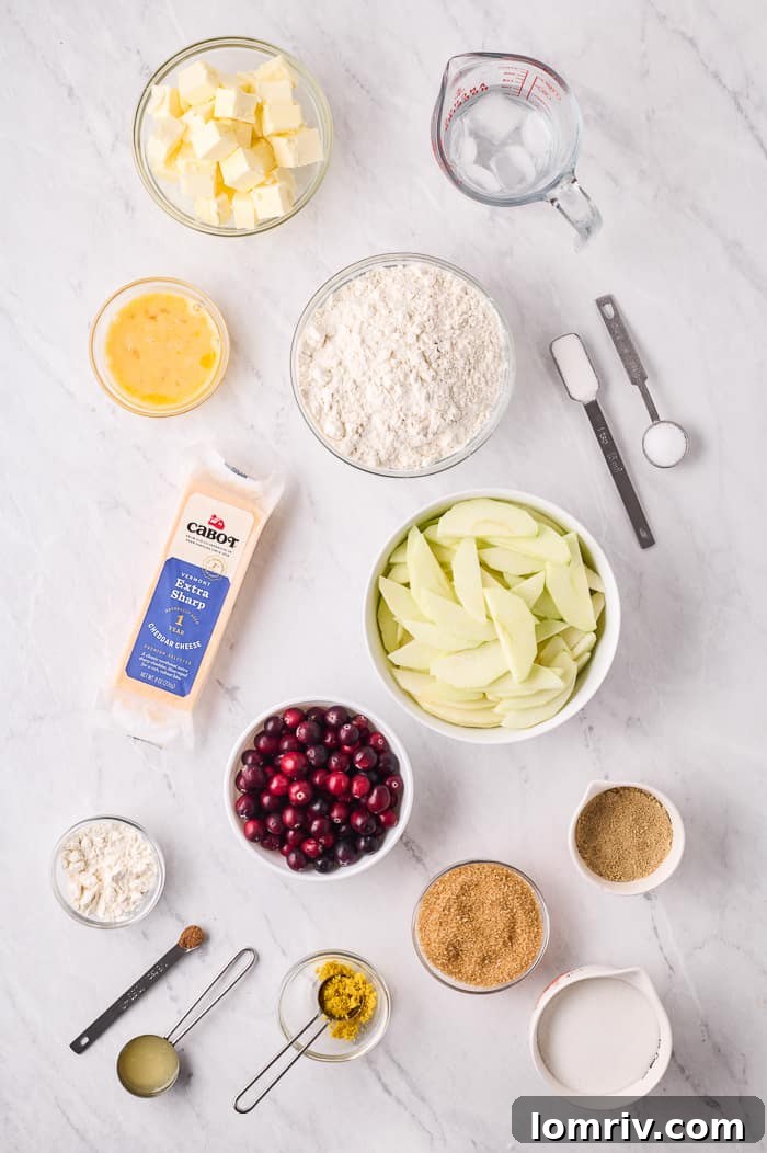 Ingredients for pie crust, including flour, butter, and grated cheddar cheese