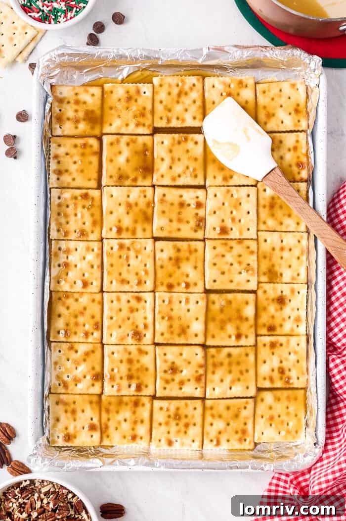 Melted chocolate spread over toffee-coated crackers