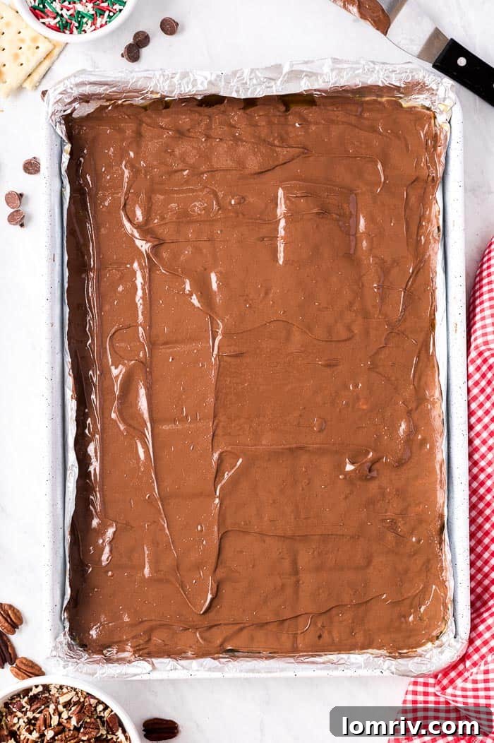 Christmas sprinkles and pecans topping melted chocolate