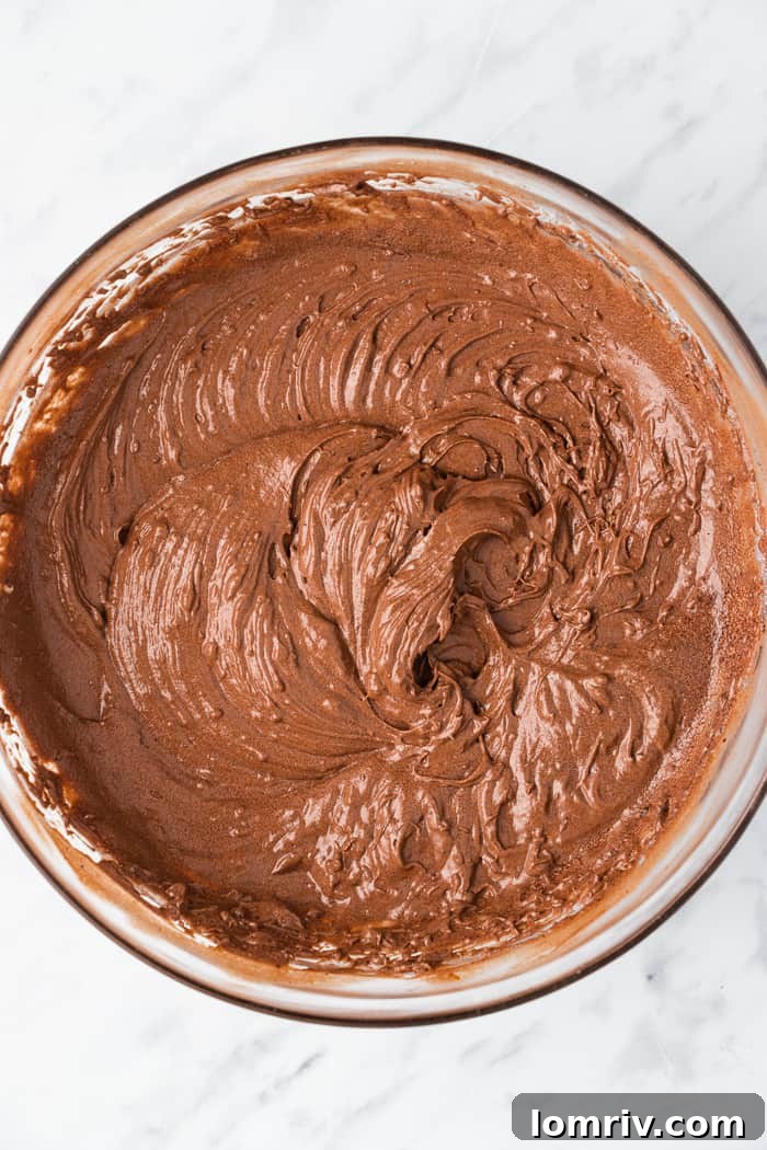 Mixing cupcake batter with an electric mixer