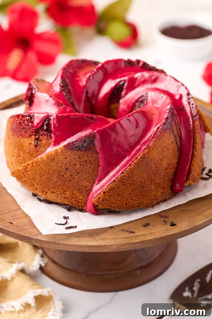 Delicious Fonio Pound Cake with Hibiscus Glaze, featuring a vibrant red color and delicate crumb