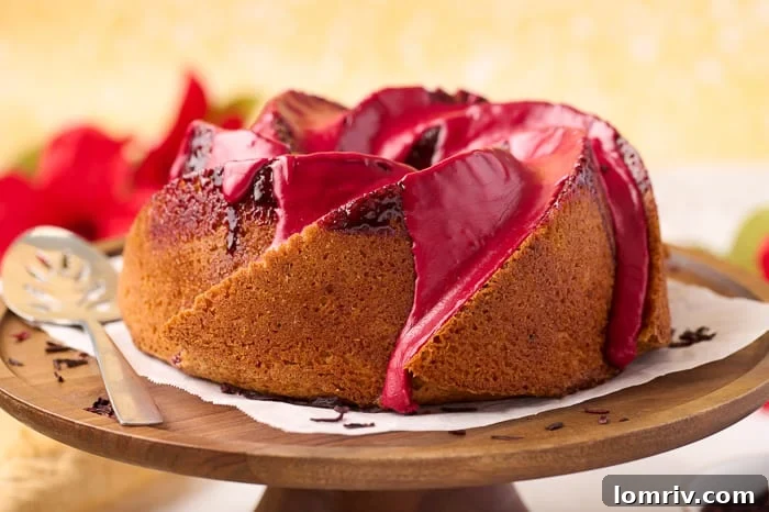 Artfully presented Fonio Pound Cake slice showing layers of cake and the sweet, tangy hibiscus glaze