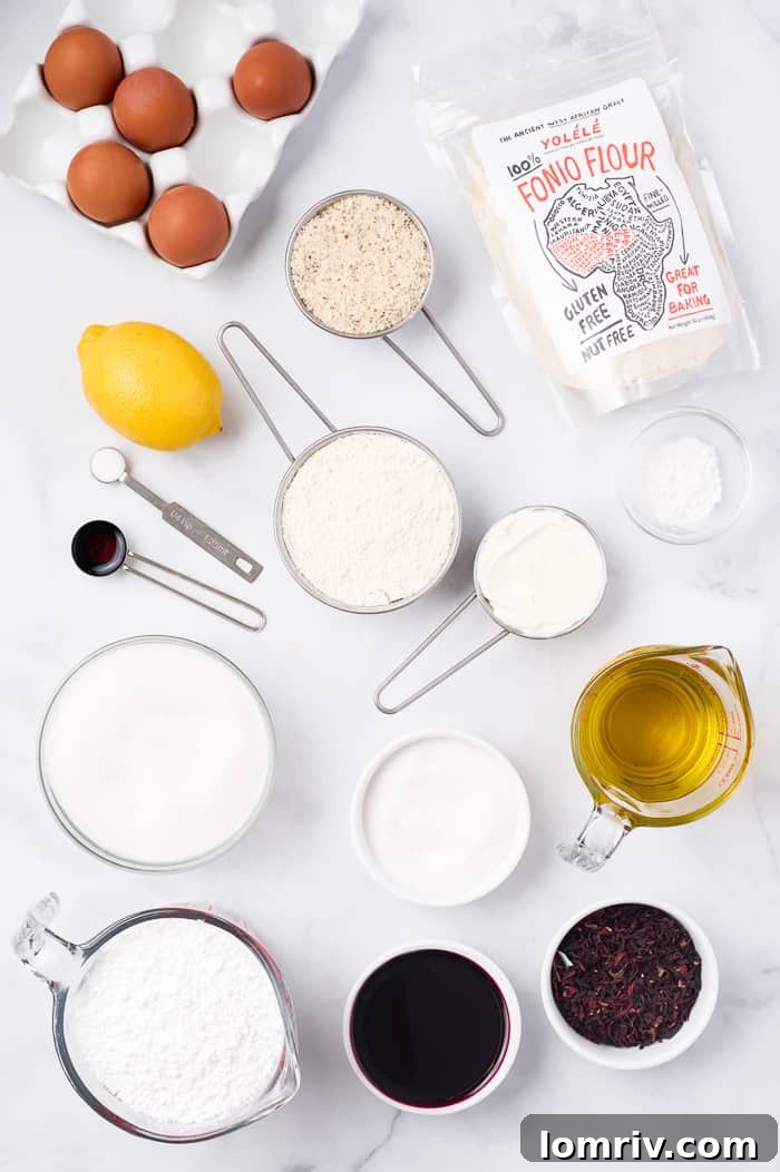All ingredients for the Fonio Pound Cake with Hibiscus Glaze neatly arranged on a kitchen counter