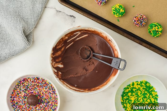 Decorating Irish cream truffles with sprinkles and cocoa