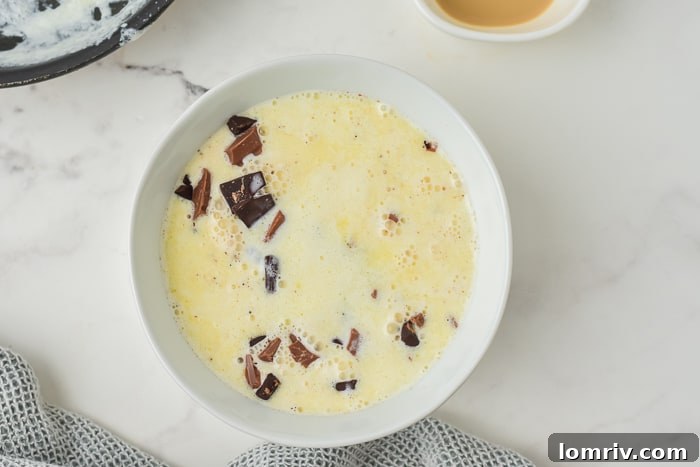 Allowing chocolate and cream to melt before stirring