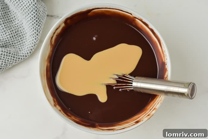 Scooping and shaping chocolate ganache into truffles