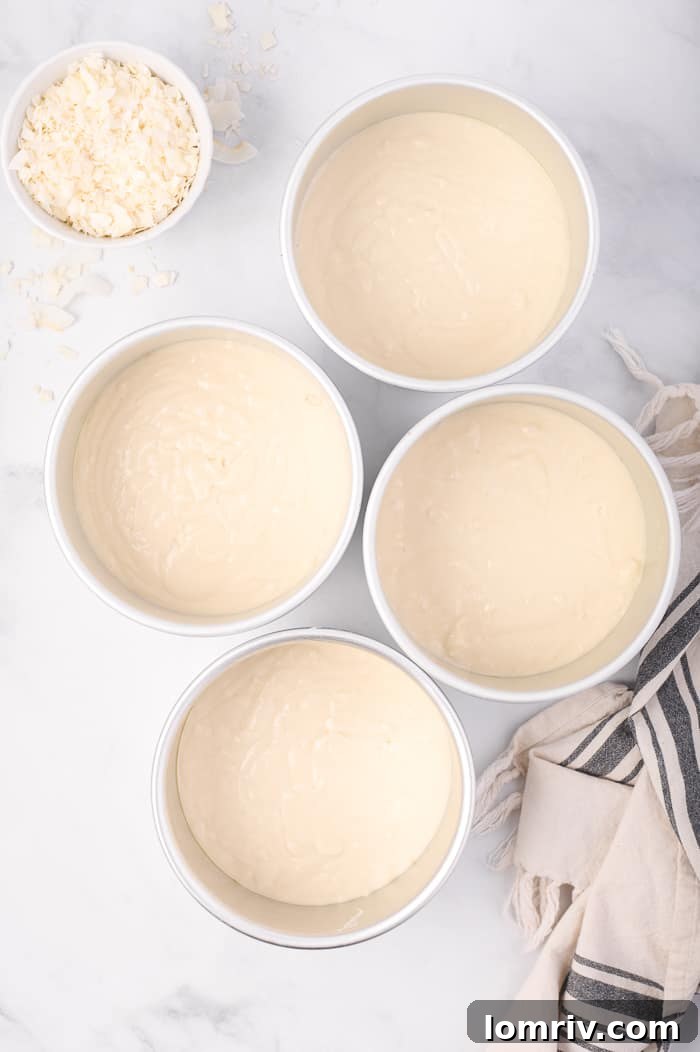 Cake Batter Poured into Prepared Pans Ready for Baking