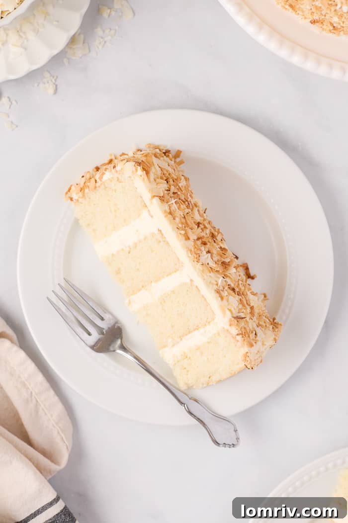 Close-up of a Slice of Coconut Layer Cake with Frosting