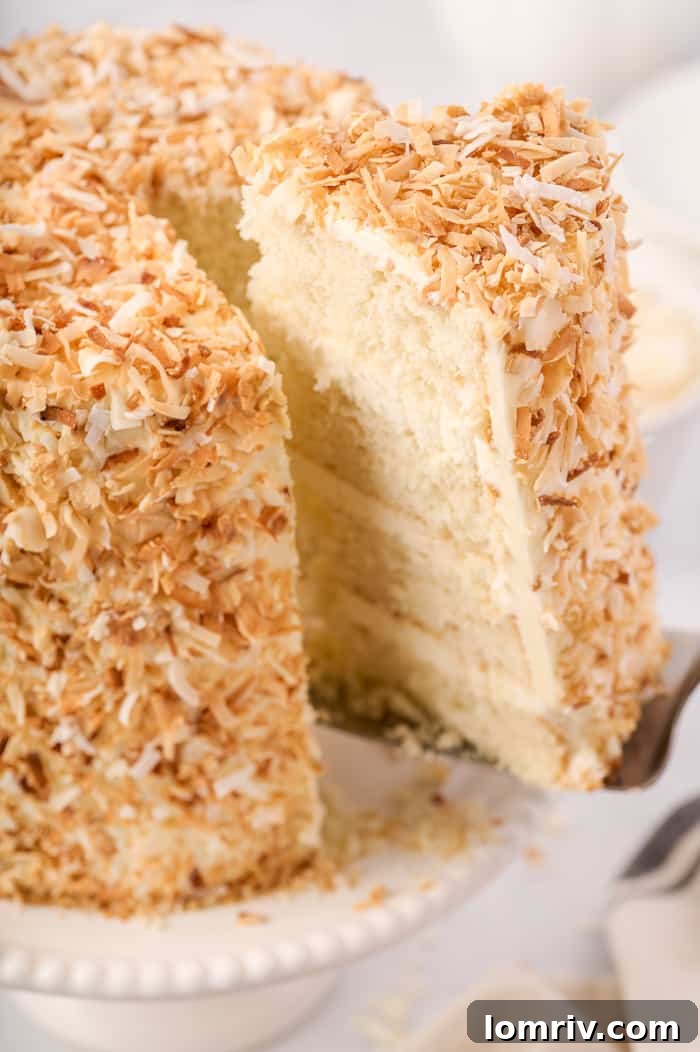 Cross-section of Tropical Coconut Layer Cake with Swiss Meringue Buttercream