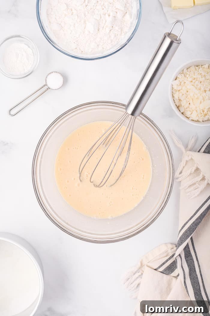 Wet Ingredients for Coconut Layer Cake in a Mixing Bowl