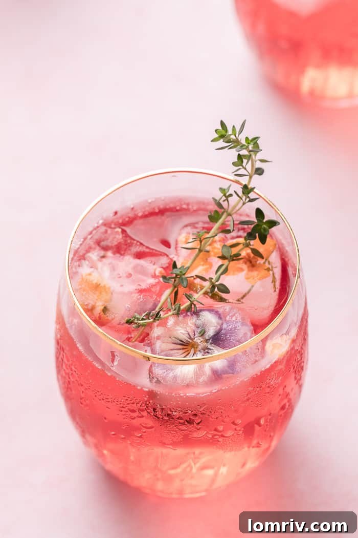 Pink Lemonade Cocktail with unique edible flower ice cubes
