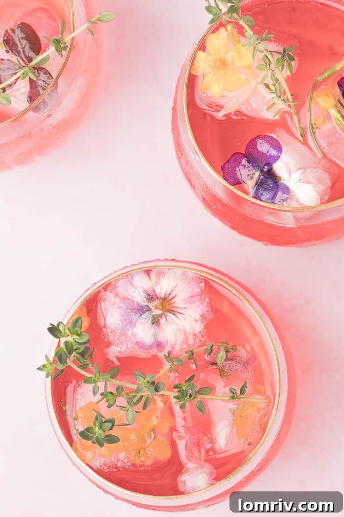 Pink Lemonade Cocktail garnished with Edible Flower Ice Cubes