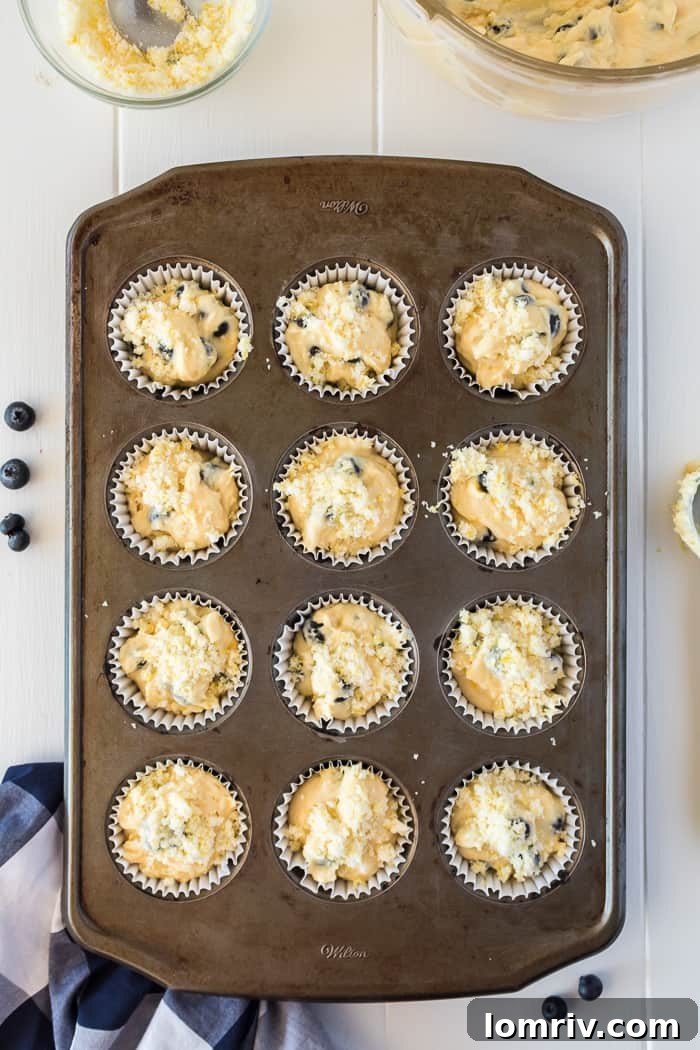 Freshly baked Lemon Blueberry Muffins cooling in the tin