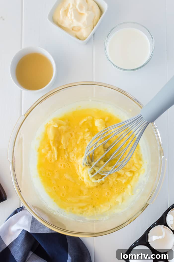 Whisking wet ingredients for lemon blueberry muffins