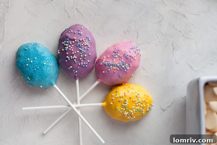 A close-up of a vibrantly decorated Easter Cake Pop, showcasing intricate details and sprinkles.
