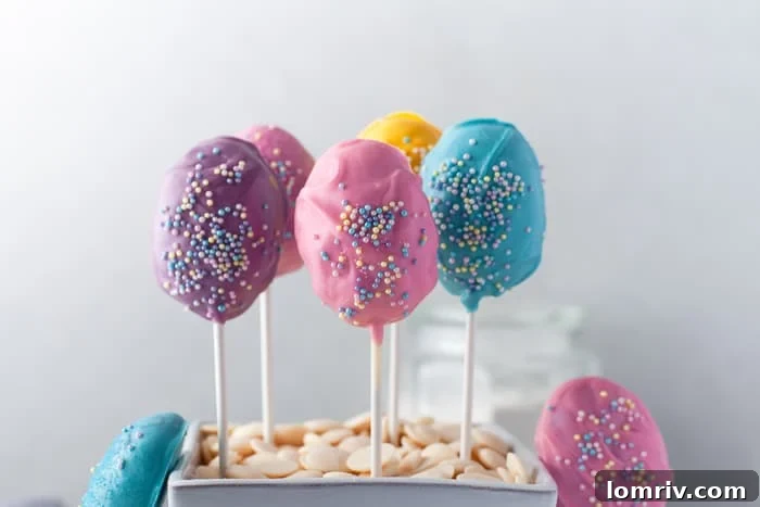 Close-up of freshly made Easter Cake Pops with vibrant candy coating, showcasing their perfect egg shape.