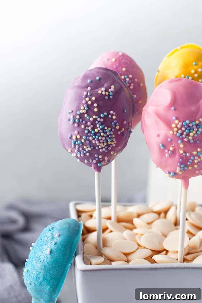 Easter Cake Pops generously covered in sprinkles and colorful candy melts.