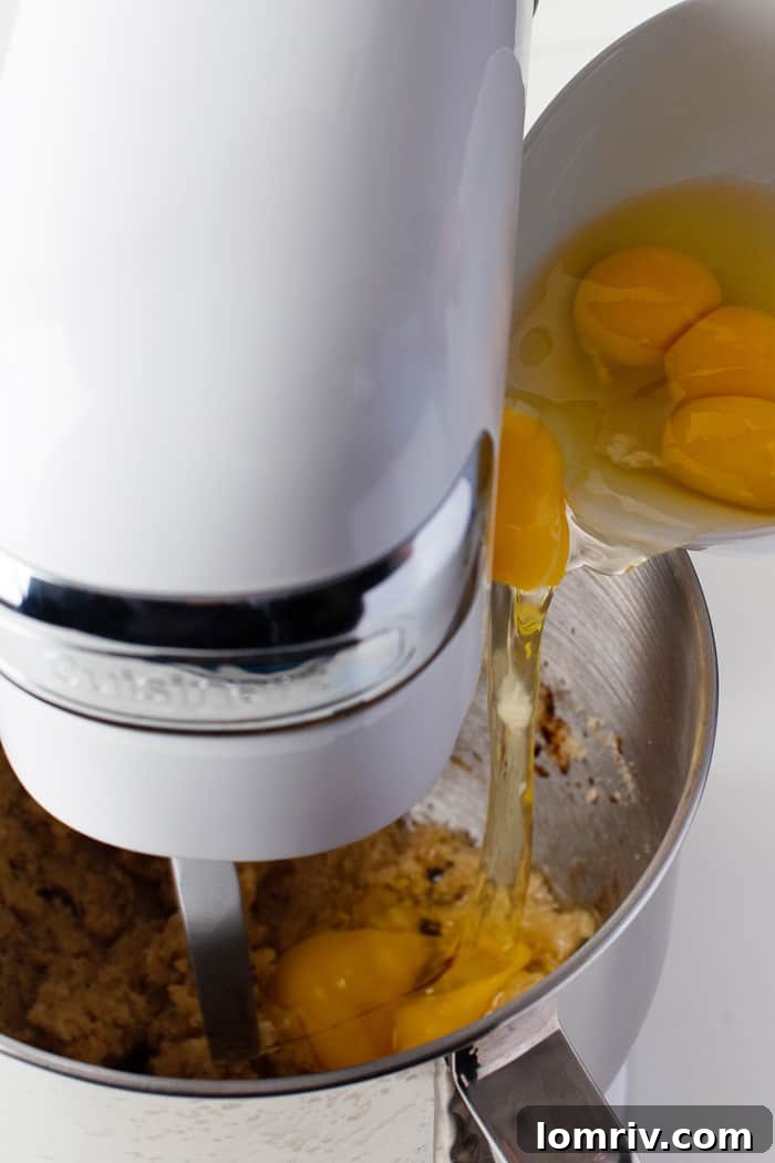 Butter and sugar being creamed together in a mixer, a key step in cake preparation.
