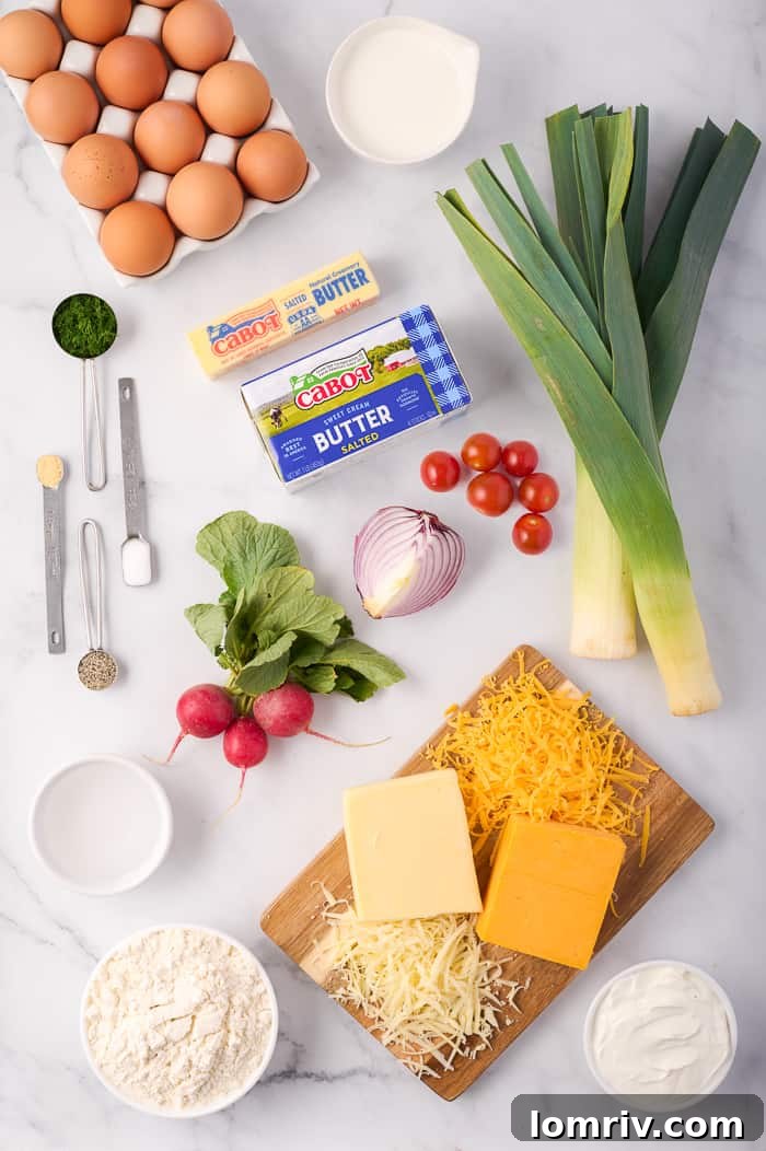 Ingredients for Farm Vegetable Quiche laid out, including Cabot cheese and butter