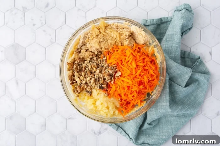 Mixing carrots, pineapple, and walnuts into batter