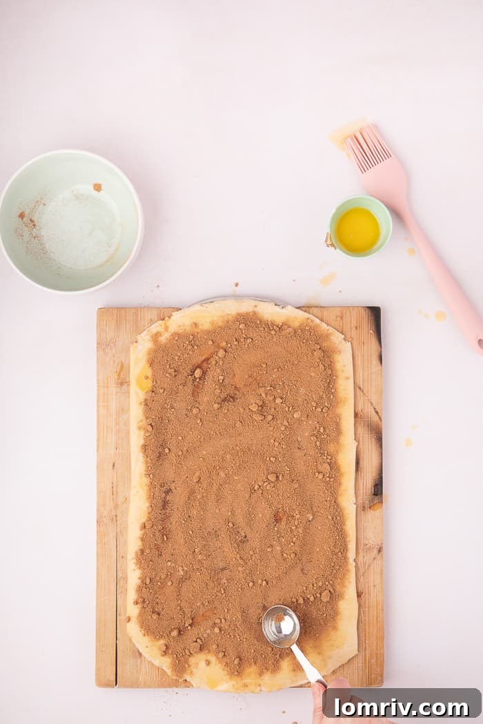 The Cinnamon Swirl Bread dough rolled, cut, and braided into its signature swirl shape.