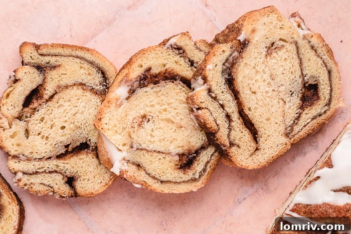 Warm slices of Cinnamon Swirl Bread with a delicate drizzle of icing.