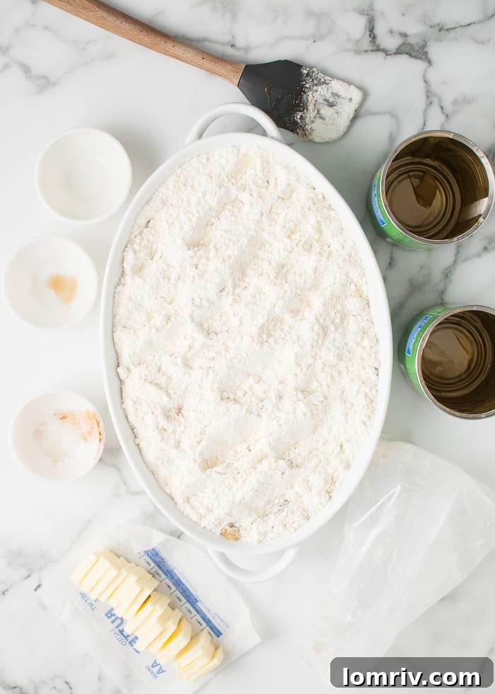 Dry cake mix being poured evenly over the spiced apple pie filling.