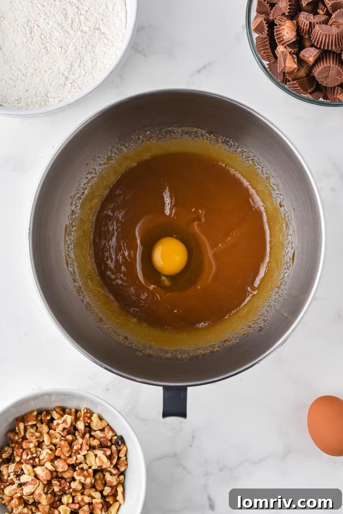 Adding Eggs to Blondie Batter