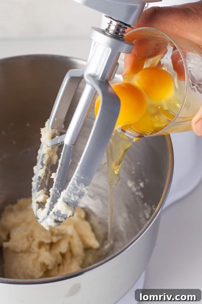 Adding vanilla and eggs to blondie batter
