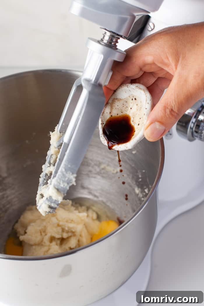 Mixing eggs into blondie batter